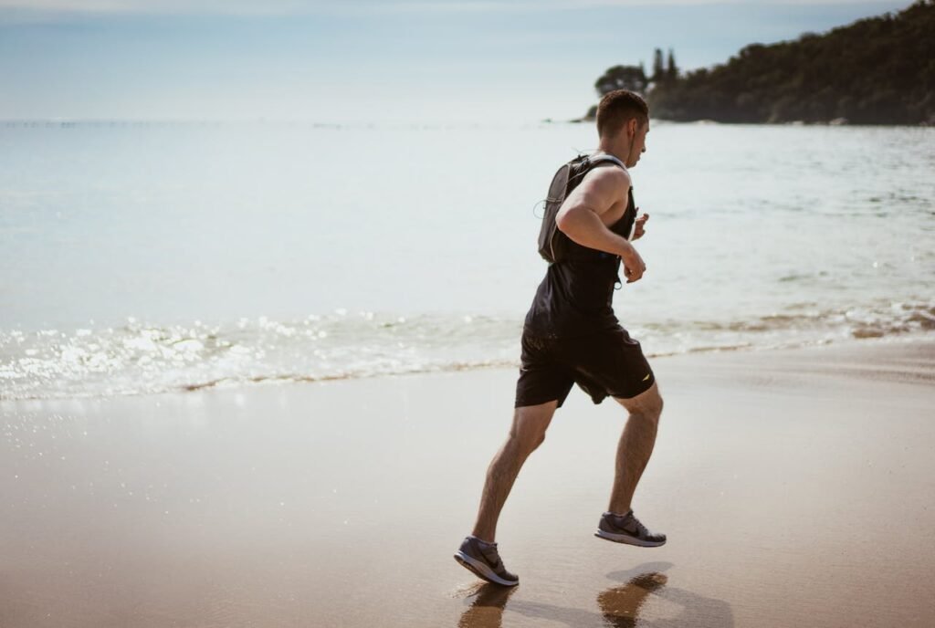 a man running in beach