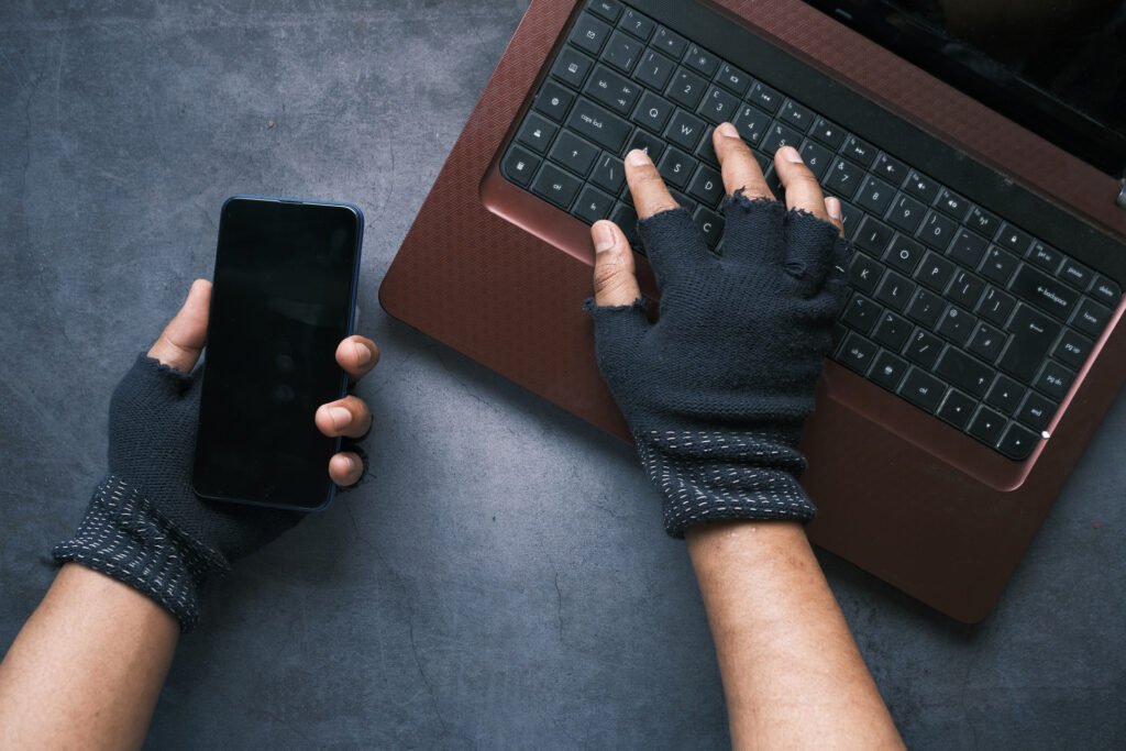 hacker hand stealing data from laptop top down عربيّةكوم Arrabiacom