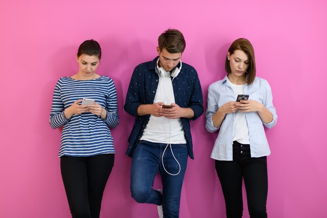 group of friends have fun and dance while using a cell phone and عربيّةكوم Arrabiacom